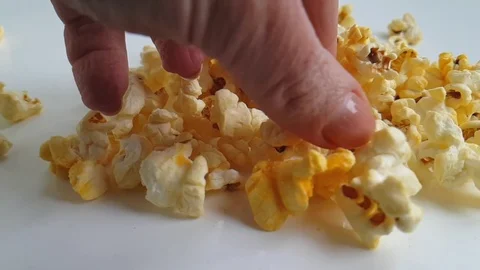 Popcorn hand on white background Video stock 87877026