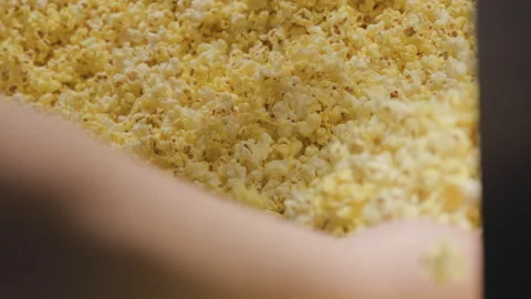 Popcorn loaded into popcorn bag slowmo Stock Footage 285566151