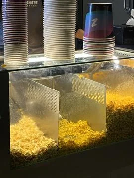 Popcorn Machine with Cups at Concession Stand Stock Photos