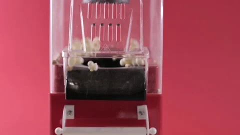 Popcorn machine. Popcorn is made in a mini machine at a party. Classic fun food Stock Footage 205154000