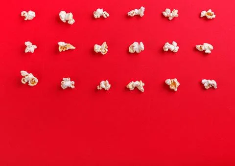 Popcorn macro on a red background Stock Photos