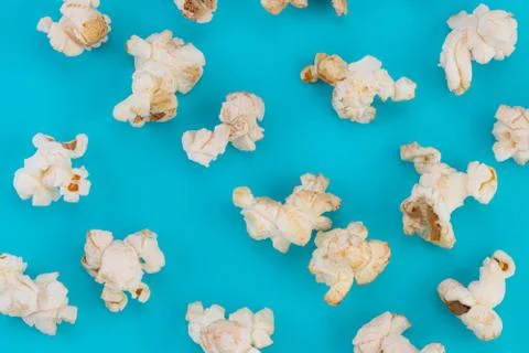 Popcorn pattern on blue  background. Top view Stock Photos