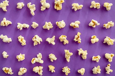 Popcorn pattern isolated on purple background Stock Photos