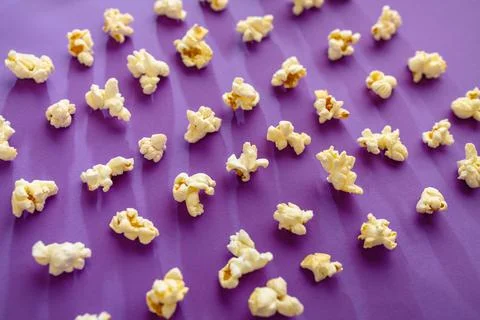 Popcorn pattern isolated on purple background Stock Photos
