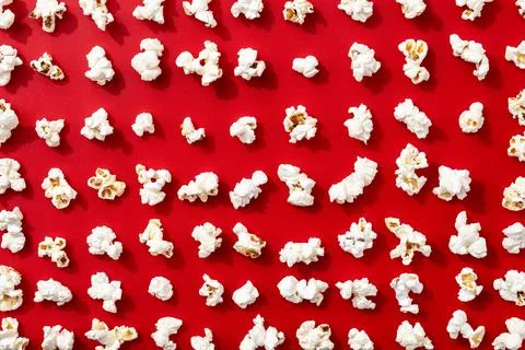 Popcorn pattern on red background Stock Photos
