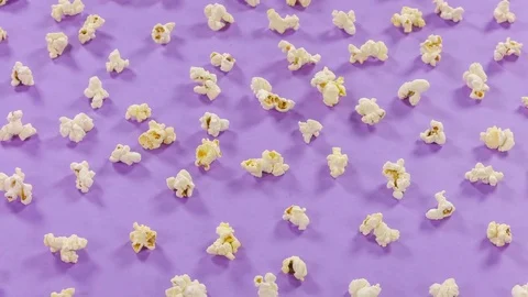 Popcorn pattern rotates on yellow background. Top view and closeup. 스톡 동영상 76589434