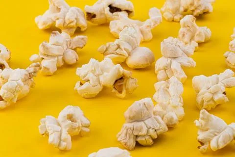 Popcorn pattern on yellow background. Top view Stock Photos