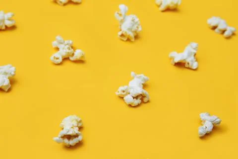 Popcorn pattern on yellow background. Top view. Film. Fast food. Corn Stock Photos