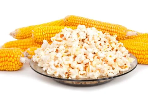 Popcorn on a plate and cobs Stock Photos