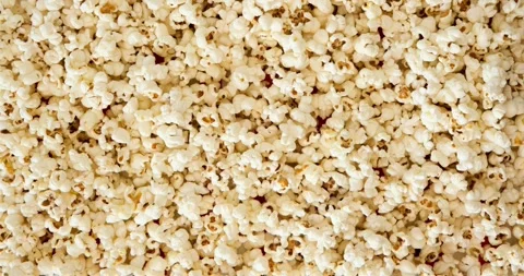 Popcorn on a red-and-white striped background. Looped 4K stop motion animation Vídeos de archivo 345118648