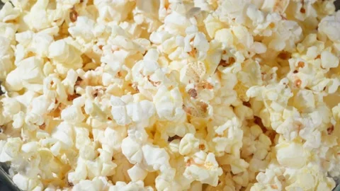 Popcorn rotates, the top view is close-up Stock Footage 155530141