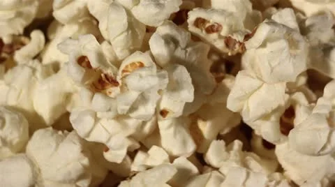 Popcorn in rotation. Macro Stock Footage 21733527