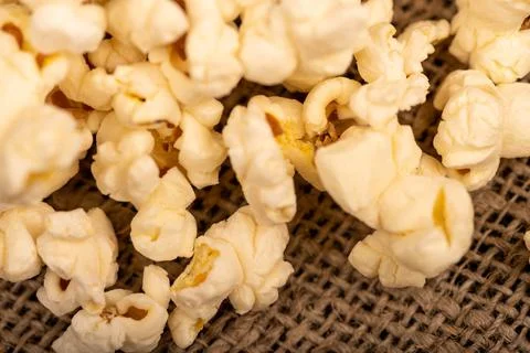 Popcorn scattered on the table. Self-isolation in the covid-19 pandemic. Stock Photos