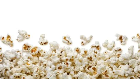 Popcorn scattered on a white background. Isolated Stock Photos