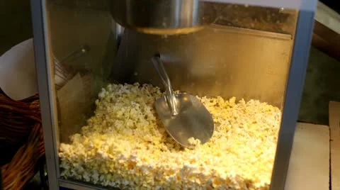 Popcorn scooped from machine Video stock 8930916