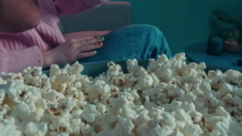 Popcorn Snacking While Watching a Movie at Home on the Sofa 库存影片 331098636