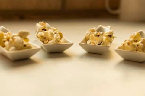 Popcorn in a spoon. Stock Photos
