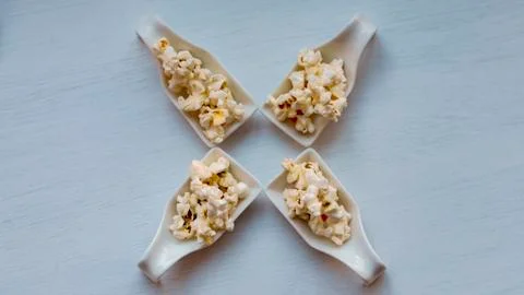 Popcorn in a spoon. Stock Photos