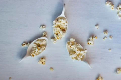 Popcorn in a spoon. Stock Photos