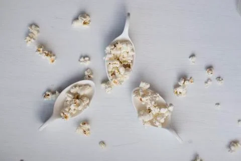 Popcorn in a spoon. Stock Photos