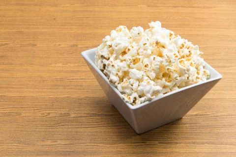 Popcorn in a square shape bowl 写真素材