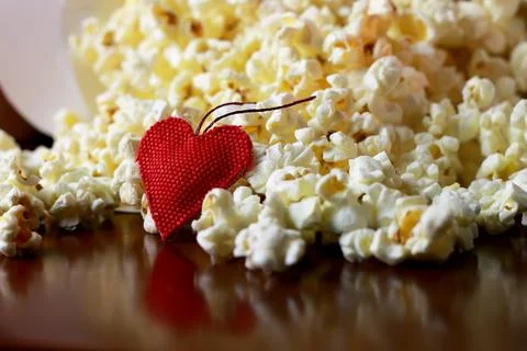 Popcorn stack with heart shape Stock Photos