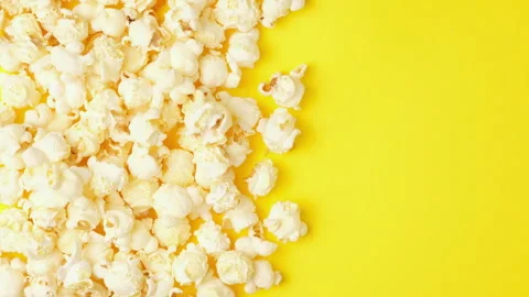 Popcorn stop motion video on bright yellow background. Popcorn changing Stock-Footage 277669577