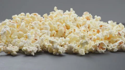 Popcorn on the table spins in a circle Stock Footage 155530198