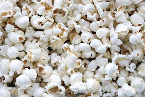 Popcorn texture background. Big amount of popcorn as pattern Stock Photos