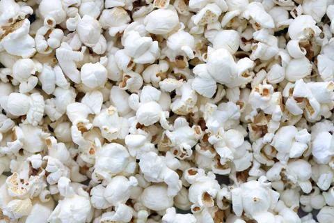 Popcorn texture background. Big amount of popcorn as pattern 스톡 사진