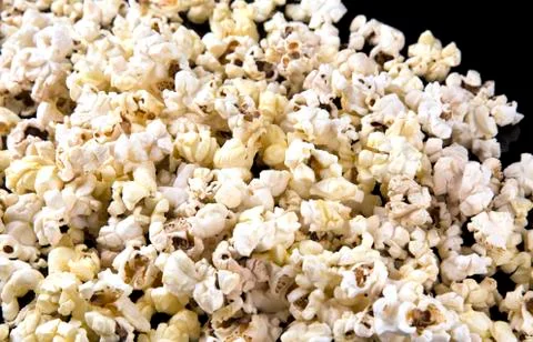Popcorn texture background on dark table Stock Photos