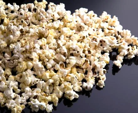 Popcorn texture background on dark table Stock Photos
