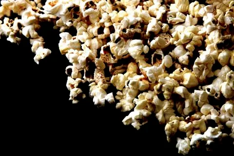 Popcorn texture background on dark table Stock Photos