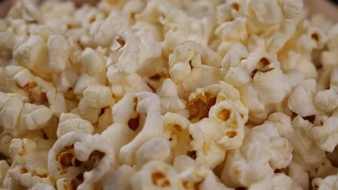 Popcorn turning in slow motion, Close-up of popcorn Stock-Footage 143753035