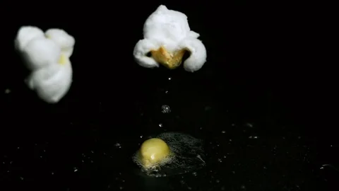 Popcorn Two Kernels Pop in Super Slow Motion Stock Footage 71357658
