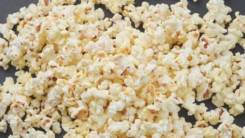 The popcorn view from above turns on the gray surface Video stock 160559002