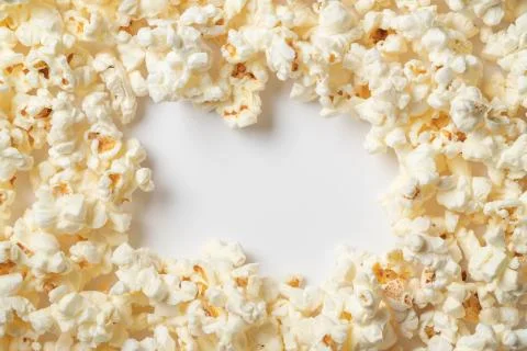 Popcorn on white background with empty space for text. Top view Stock Photos