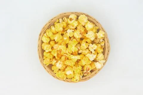 Popcorn in wicker basket. Stock Photos