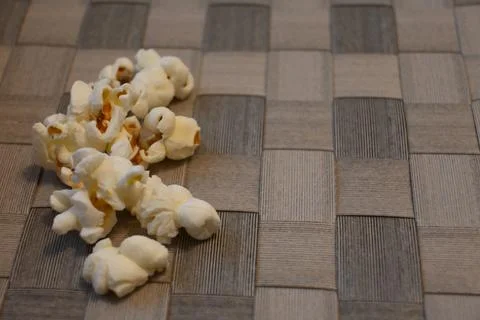 Popcorn on a woven tabletop with copy space Stock Photos