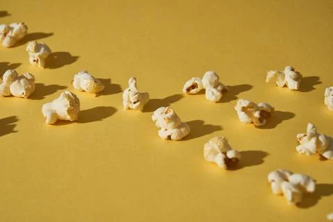 Popcorn on a yellow background. Copy space. Pop corn collection. Different si Stock Photos