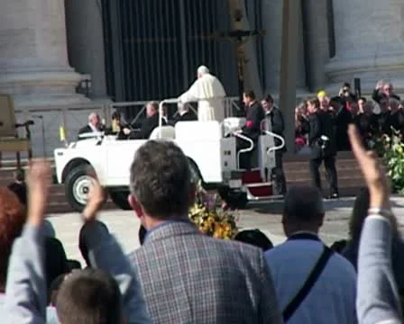 Pope John Paul II in popemobile (zoom out St Peters) Stock Footage