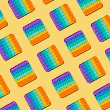 Popit toy pattern on yellow background, top view Foto stock