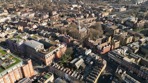 Poplar, Tower Hamlets. Aerial view of Canary Wharf, London, UK 스톡 동영상 329785063