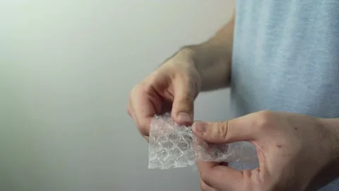 Popping bubble wrap Stock Footage 173122701