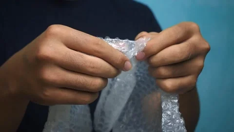 Popping bubble wrap Stock Footage 292976304
