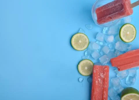 Popsicle and lemon on a blue background Stock Photos