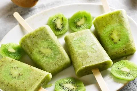 Popsicles from kiwi Stock Photos