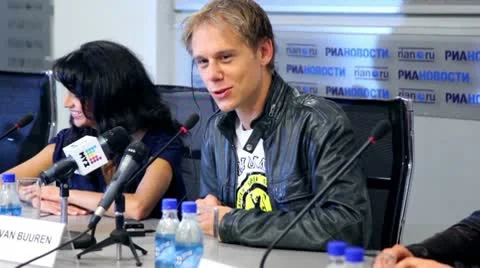 Popular Dutch DJ Armin Van Buuren smiles at press conferences Stock Footage 10680215