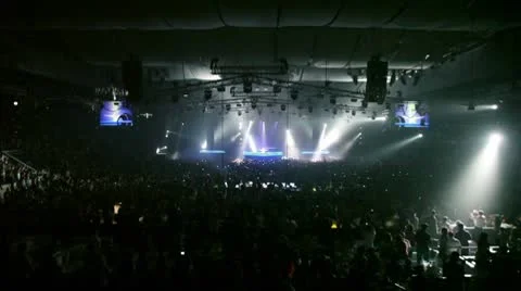 Popular Dutch DJ Armin Van Buuren jump on stage, many people at rave party Stock Footage 10680349