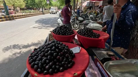 Popular fruit java plum is Reddy to sold in fruit   market in monsoon season Stock Footage 277322787